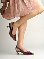Women's Cherry Patent Pointed-Toe Slingback Heels with Mary Jane Strap and Gold Buckle Detail